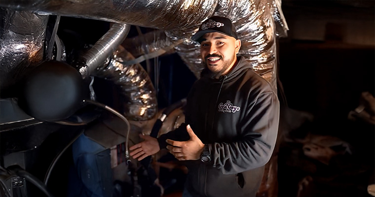 Joel from go2guy in front of furnace